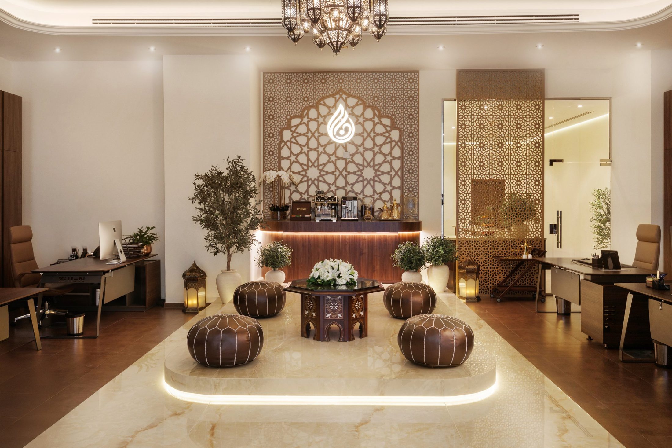 DANA studio majlis lounge with backlit girih arch and logo